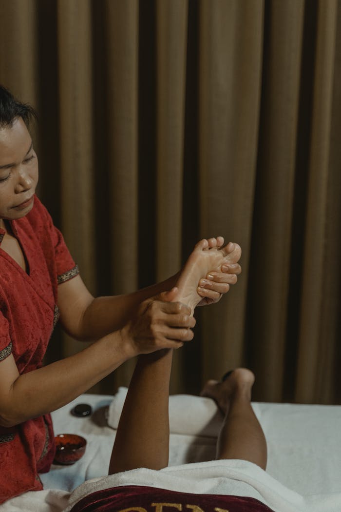 Experience relaxation with a soothing foot massage in a serene spa setting.